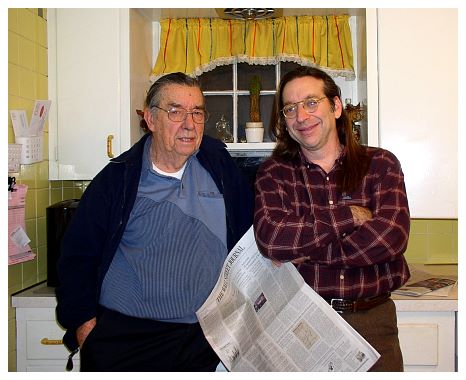 2003 - Rob and son Garry, with their favorite newspaper.JPG